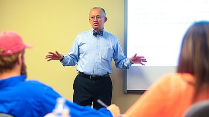 Dr. Sam Ayers telling a story to his students