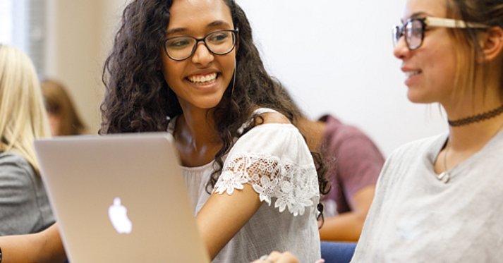 Students in class with laptop