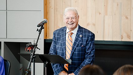 Tony Gullo smiling at the dedication to Gullo Hall