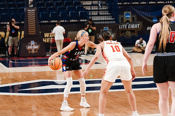 LCU senior Maci Maddox dribbling the ball up the court