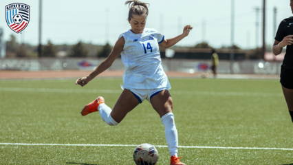 Lexi De La Cruz getting ready to kick a soccer ball in the LCU soccer uniform