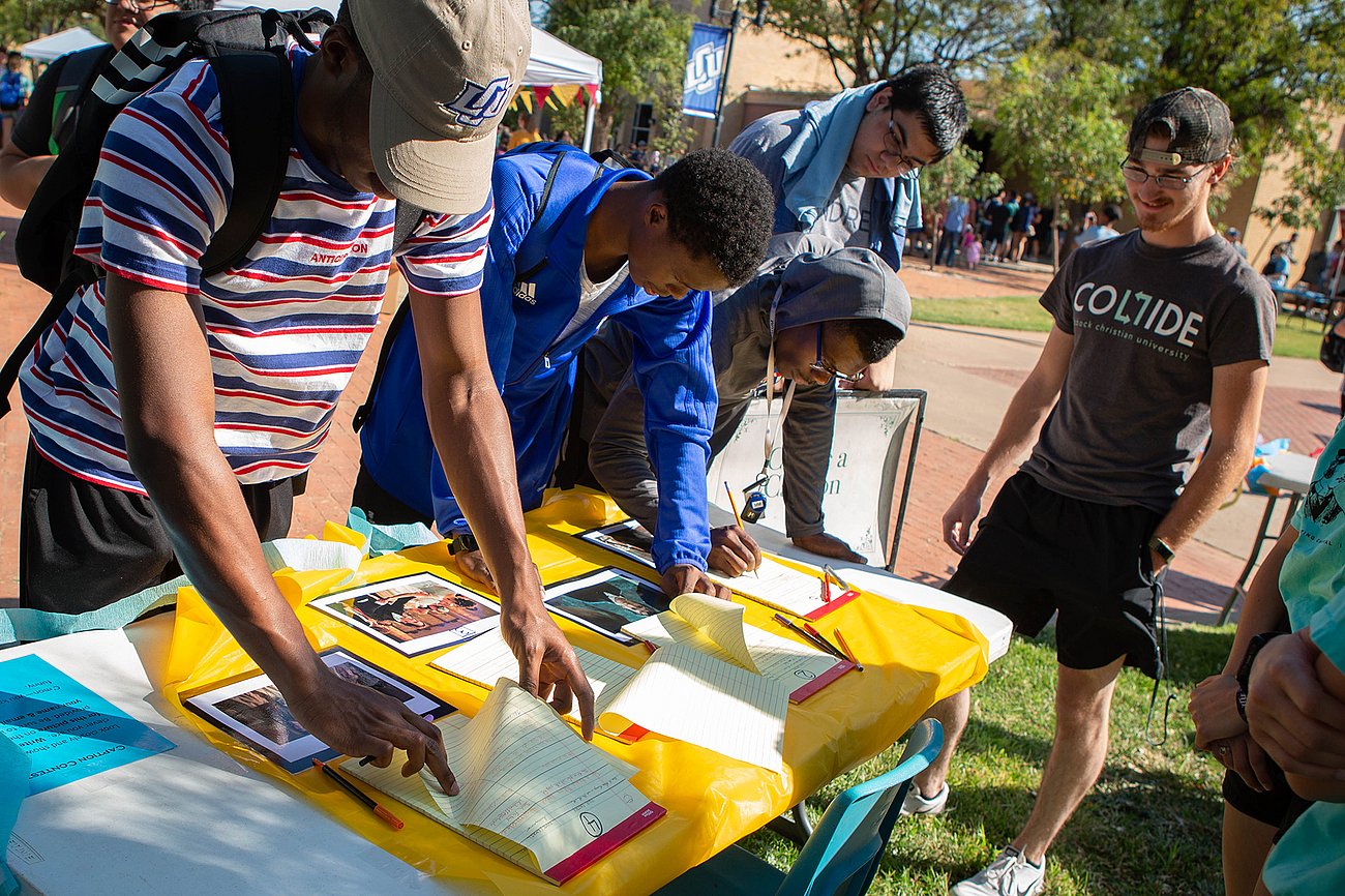 students working on captions at the annual writing carnival