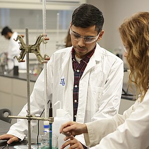 Student and Professor working on research in lab