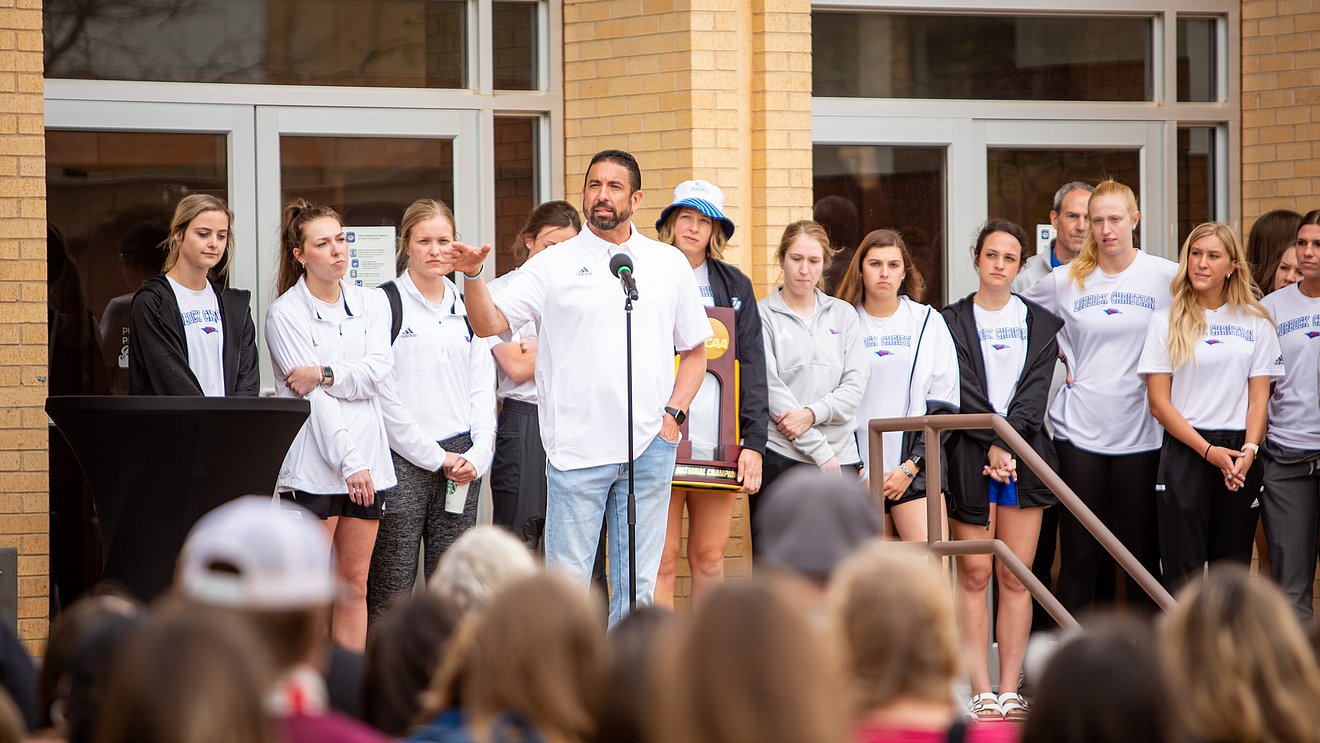 Head Coach Steve Gomez addresses the audience on the Moody steps