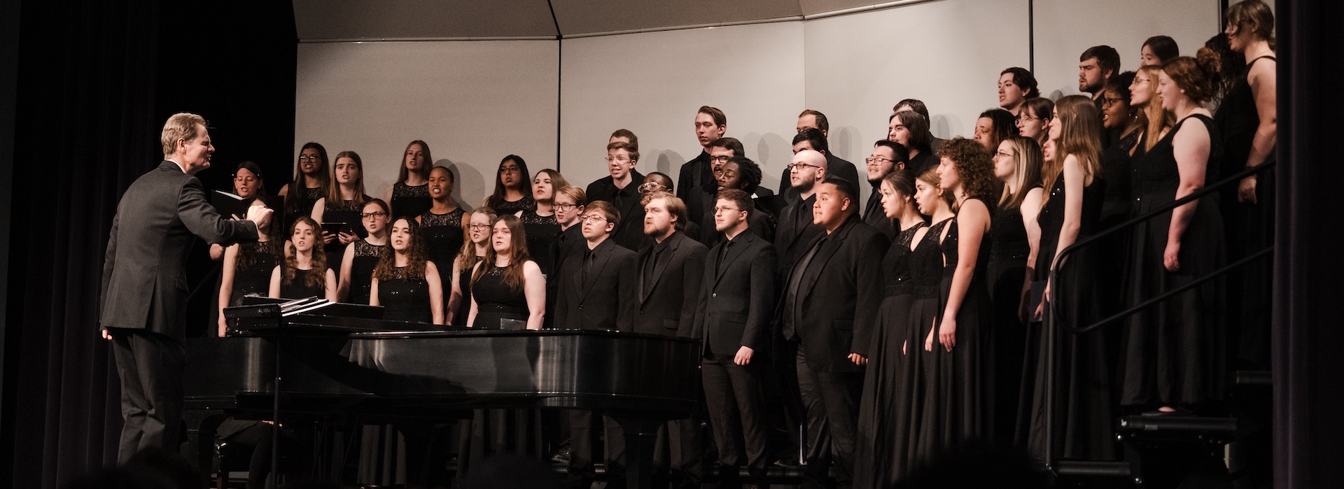 LCU Choir in black concert dress performing on stage