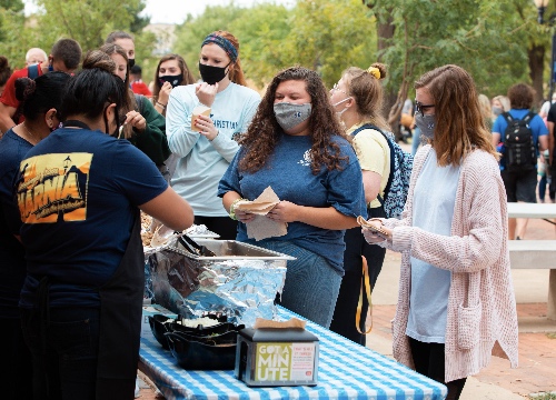 Students line up for street tacos