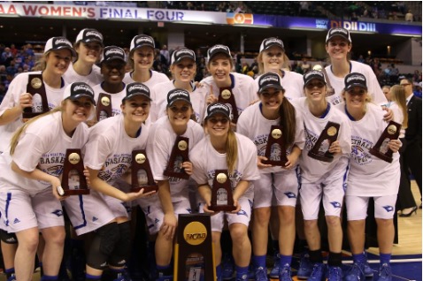 National Championship team posing with trophies