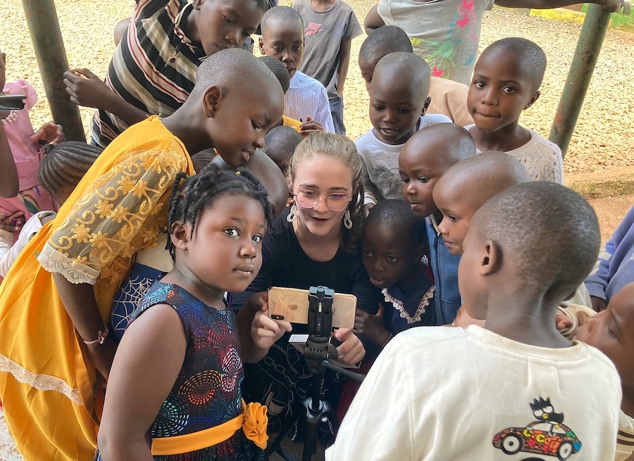 LCU Bible student taking selfie with African children