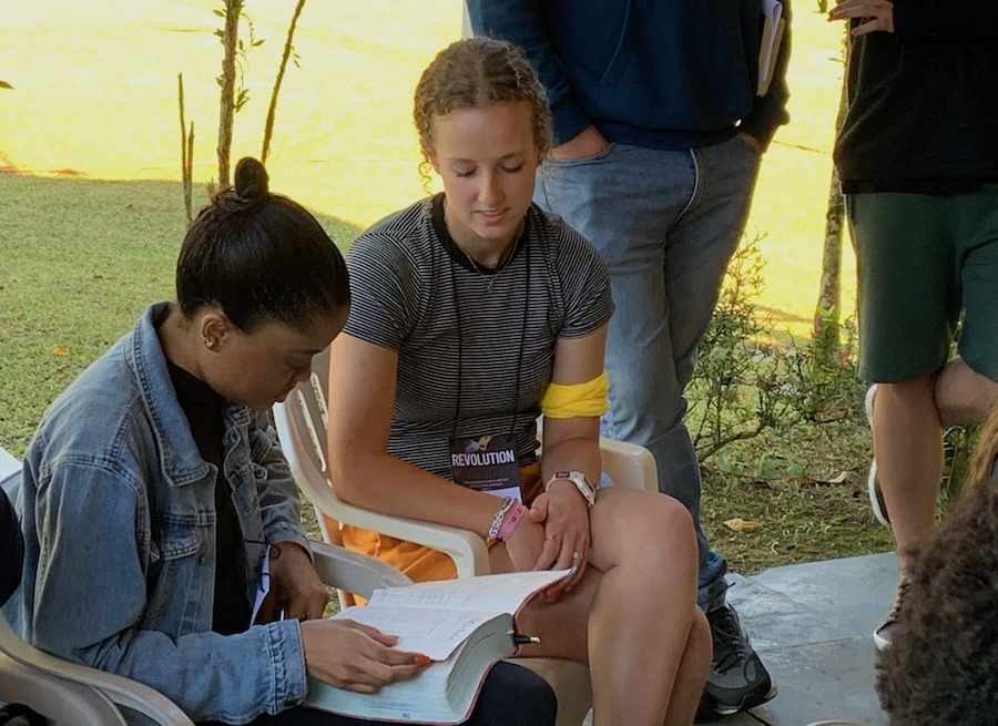 LCU Student reading the Bible with another woman