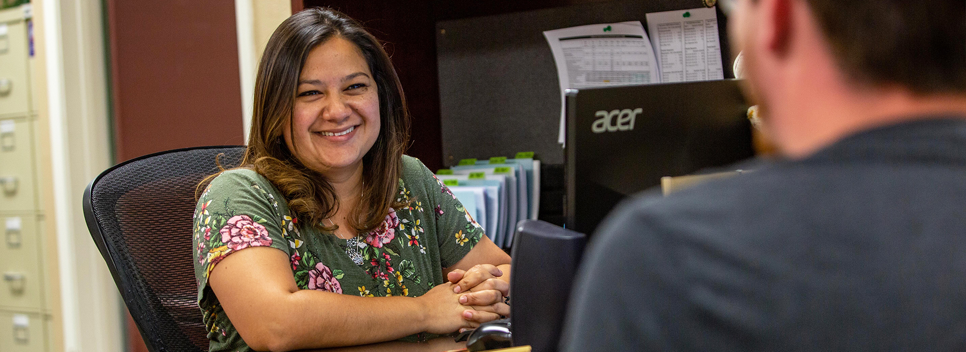 Registrar working with student