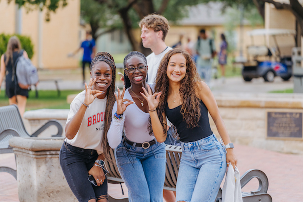 New Students throwing up the Chap hand sign